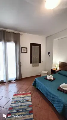 a hotel room with a bed and a window at casa vacanze Vita 2 in Balestrate