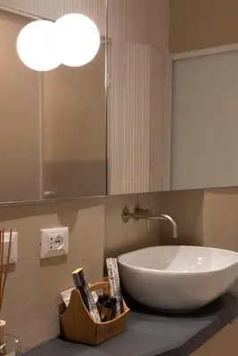 a bathroom with a white sink and a mirror at Aquacharme in Palermo