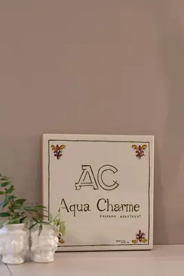a sign for aac extra chine sitting on a table at Aquacharme in Palermo