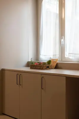 a kitchen counter with a basket of fruit and a window at Aquacharme in Palermo