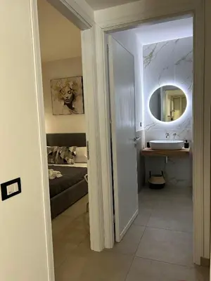a bathroom with a sink and a mirror at Matteotti35 in Terrasini
