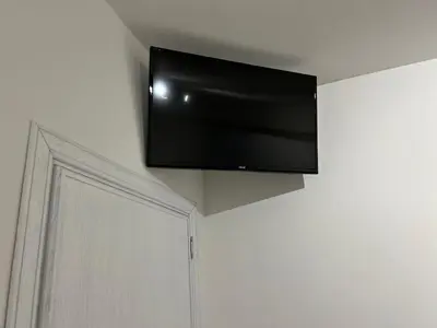 a flat screen tv hanging on a wall at Matteotti35 in Terrasini