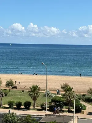 a view of a beach with people riding bikes at A casa di Mamma in Palermo
