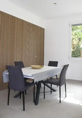 a dining room with a table and chairs at Villa Mercurio Mondello in Mondello