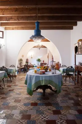 a room with a table with fruit on it at Baglio Buccellato in Scopello