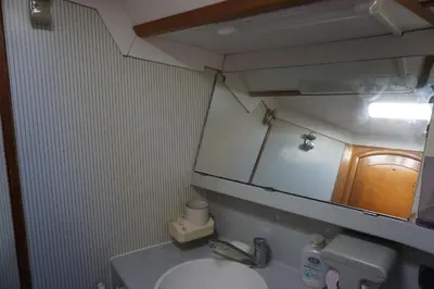 a bathroom with a sink and a mirror and a toilet at Gloria Sailing in Castellammare del Golfo
