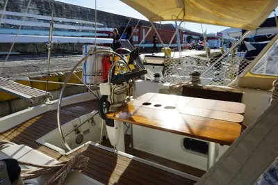 a boat with a wooden deck in a dock at Gloria Sailing in Castellammare del Golfo