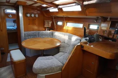 a living room with a table in a boat at Gloria Sailing in Castellammare del Golfo