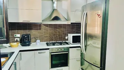 a kitchen with a stove and a refrigerator at Casa Graziella Vacanze in Palermo