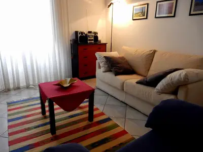 a living room with a couch and a red table at Terrasini Siracasa in Terrasini