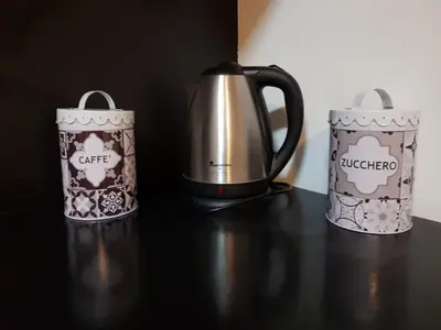 two coffee pots sitting on a table next to each other at appartamento politeama in Palermo