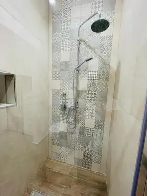 a shower with a glass door in a bathroom at I Faraglioni Comfort Rooms in Terrasini