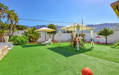 a backyard with a playground with a basketball at Gorgeous Home In Terrasini in Terrasini