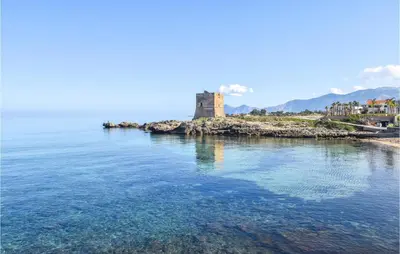 a castle on an island in the water at Gorgeous Home In Terrasini in Terrasini