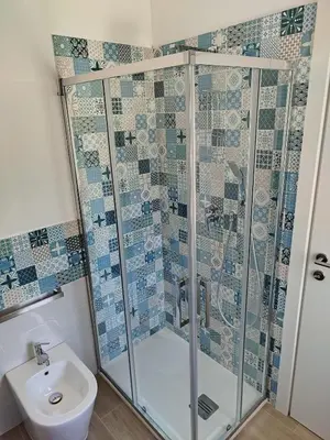 a bathroom with a shower and a sink at Mondello Sea House in Palermo