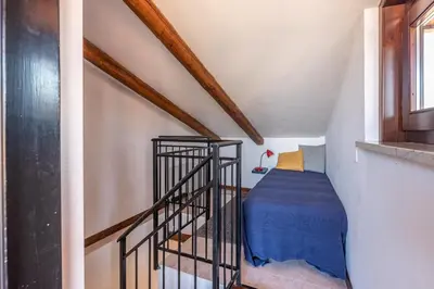 a staircase with a blue bed in a room at Le terrazze nel cuore della Kalsa by Wonderful Italy in Palermo