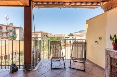 two chairs on a balcony with a view at Le terrazze nel cuore della Kalsa by Wonderful Italy in Palermo