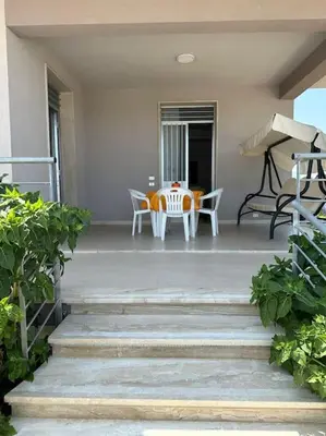a patio with a table and chairs on a porch at Casa vacanze Elisir Del Golfo in Alcamo