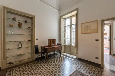 a home office with a desk and a window at Amari Elegant Apartment by Wonderful Italy in Palermo