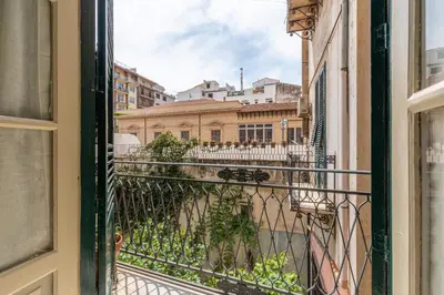 a balcony with a view of a city at Amari Elegant Apartment by Wonderful Italy in Palermo