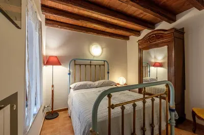 a bedroom with a bed and a mirror at Amari Elegant Apartment by Wonderful Italy in Palermo