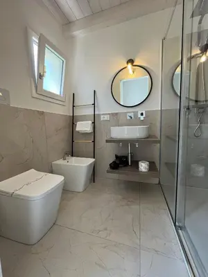 a bathroom with a toilet and a sink and a shower at Sicilian Paradise Casa Vacanze in Castellammare del Golfo