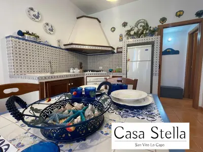 a kitchen with a table with a bowl on it at Casa Stella San Vito Lo Capo in San Vito lo Capo