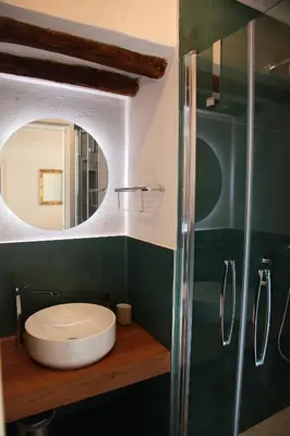 a bathroom with a sink and a mirror at Alle Absidi della Cattedrale in Palermo