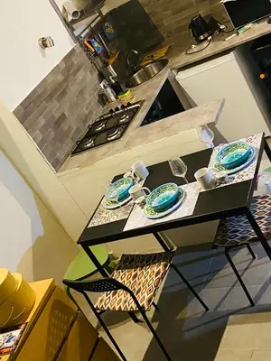a small table in a kitchen with plates on it at casetta della cattedrale in Palermo