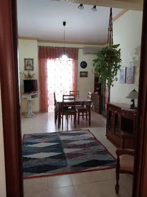 a kitchen and dining room with a table and chairs at ROOM VISTAMARE PALERMO in Palermo