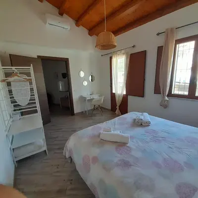 a bedroom with a large bed in a room at Enzo'S Suite in Palermo