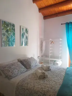 a bedroom with two beds with stuffed animals on the bed at Enzo'S Suite in Palermo