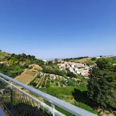 a view of a town from the balcony of a house at La Rosa dei venti in Calatafimi