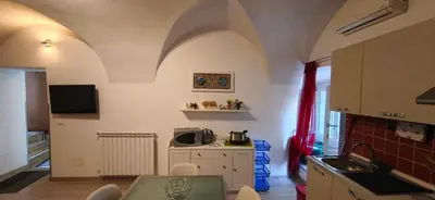 a bedroom with a bed and a dresser at Daysin Apartment in Palermo
