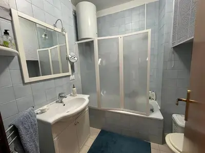 a bathroom with a shower and a sink and a toilet at Petrocelli 364 in Palermo