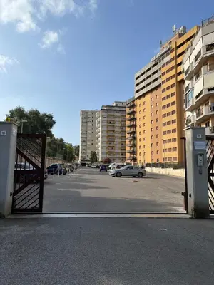 a parking lot with cars parked in a parking lot at Petrocelli 364 in Palermo