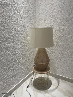 a lamp sitting on a table next to a wall at Ischia suite in Termini Imerese