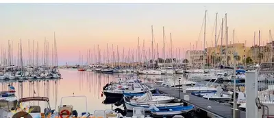 a bunch of boats docked in a harbor at Rosdani Apartment in Palermo