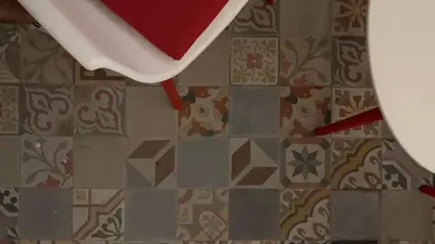 a view of a tile floor with a white table at Palazzo Maqueda in Palermo