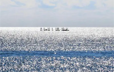 a group of sailboats in the ocean on the water at 3 Bedroom Gorgeous Home In Trappeto in Trappeto