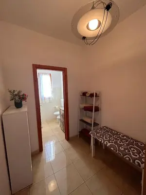 a room with a room with a mirror and a shelf at Le Trottole Apartment in Palermo