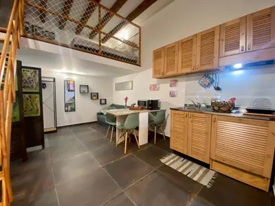 a kitchen with a table and a dining room at Casa Labi in Termini Imerese