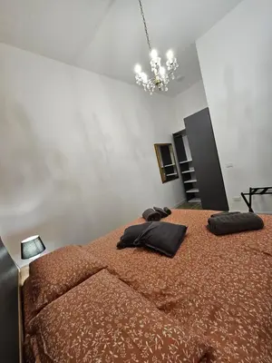 a bedroom with a large bed with two pillows on it at Lu Màri case vacanze in Balestrate