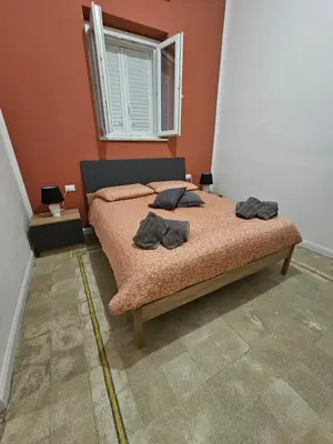 a bedroom with a bed with two pillows on it at Lu Màri case vacanze in Balestrate
