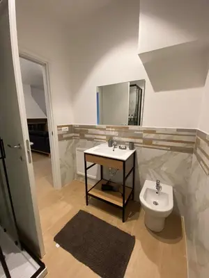 a bathroom with a sink and a toilet at Artemide 15 New Apartment near Mondello in Palermo