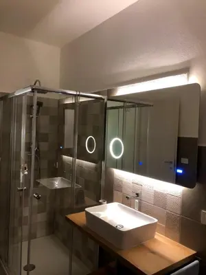 a bathroom with a sink and a shower at TOURIST HOUSE Le casette di Sofì in Bagheria