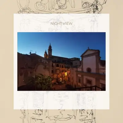 a view of a city at night at I Canti Comfort Rooms in Palermo