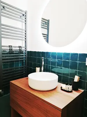 a bathroom with a sink and a mirror at I Canti Comfort Rooms in Palermo