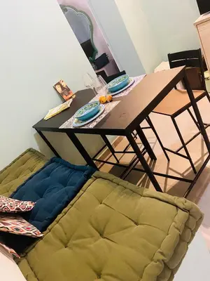 a wooden table with a couch under it with a tableablish at suite della cattedrale in Palermo