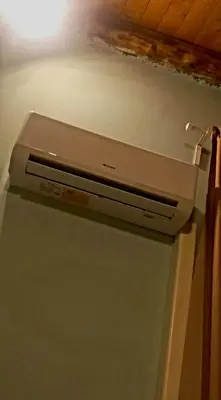 a microwave sitting on top of a refrigerator at suite della cattedrale in Palermo